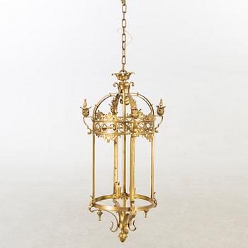A 20th century brass ceiling lamp in Louis XV-style.