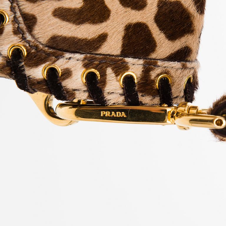 An Animal Print Pony Hair Shoulder Bag.