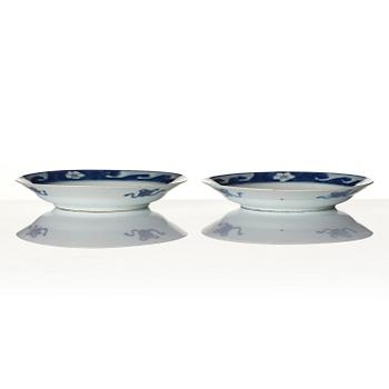 A pair of blue and white 'dragon and fish dishes', Qing dynasty, Kangxi (1662-1722).