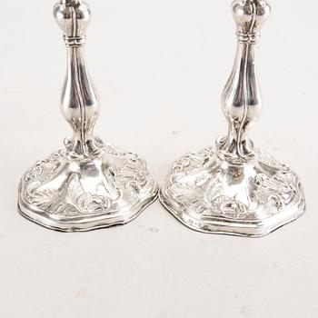 A 19th century pair of silver candle sticks mark of Oskar Närman Mariestad 1877.