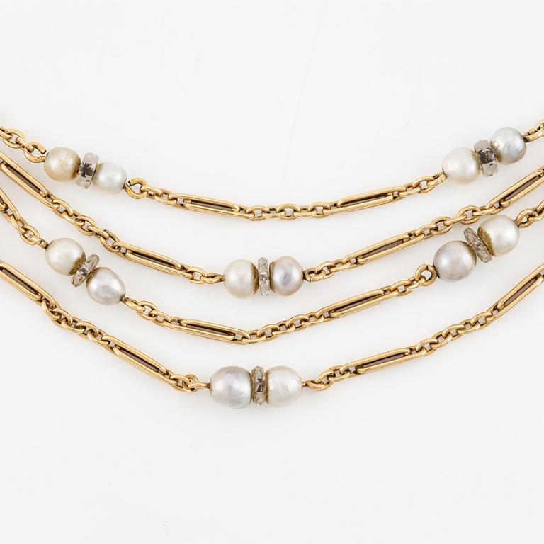 A W.A. Bolin necklace in 18K gold with pearls and white discs.