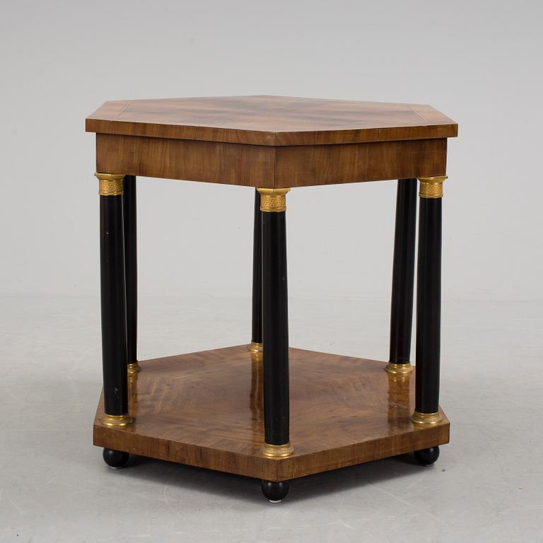 An empire style table, early 20th century.