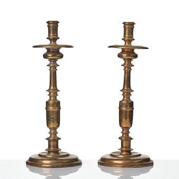 A pair of baroque brass candlesticks, 18th century.
