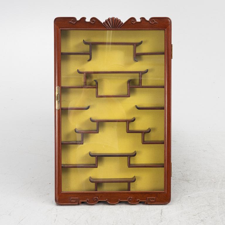 A wall-hanged display cabinet, China, second half of the 20th century.