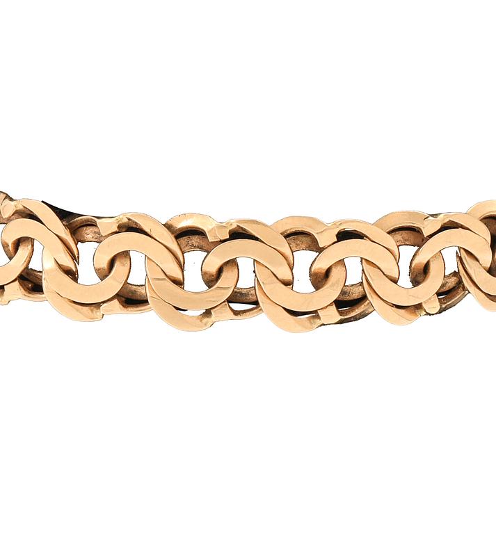 An 18K gold Bismarck bracelet.