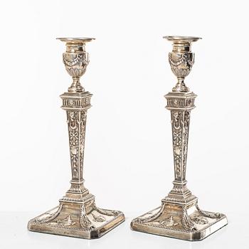 A pair of English silver candlesticks, mark of William Hutton & Sons Ltd, London 1902.