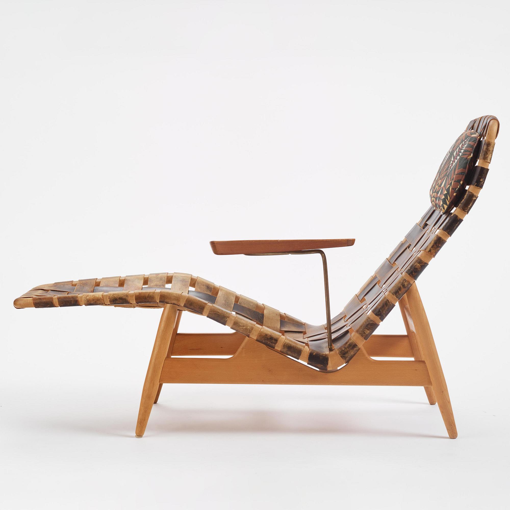 Arne Vodder, a woven leather lounge chair with attached side table, Bovirke, Denmark, 1950s.