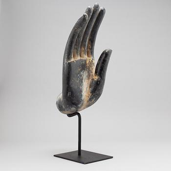 A wooden sculpture of Buddhas hand, Thailand, 20th century.