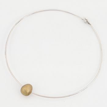 Gunilla Lantz, silver and gilded egg necklace.