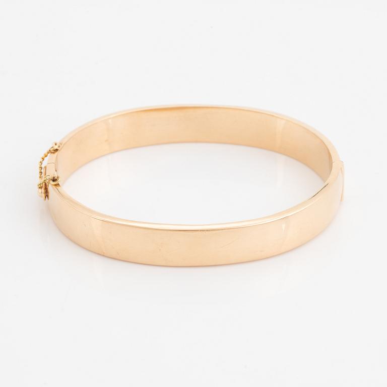 A 14K gold bracelet.