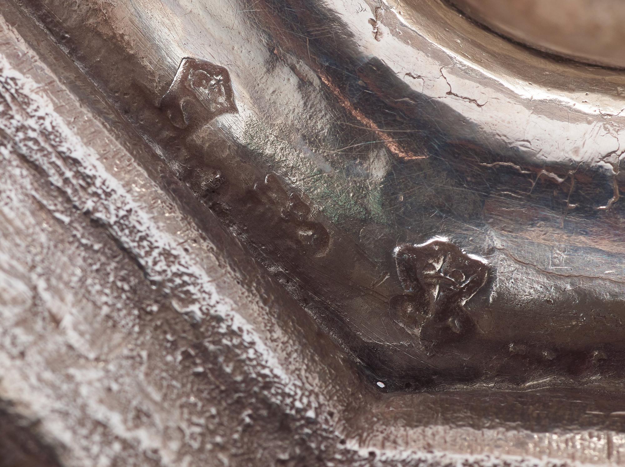 A pair of European 18th century silver candlesticks, unidentified makers mark.