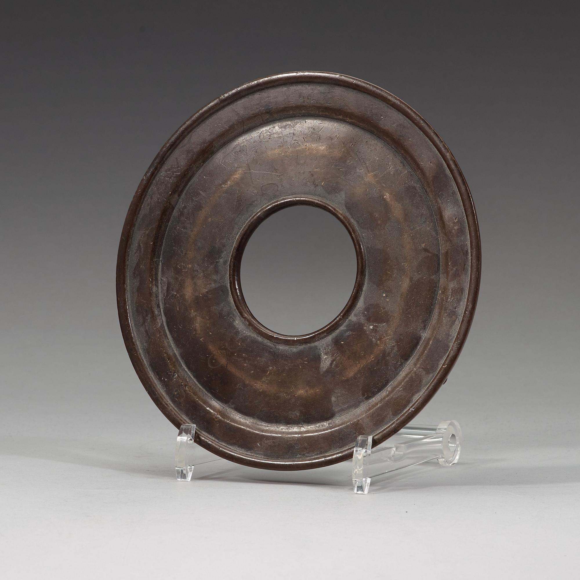 A bronze tripod censer with cover and stand, Qing dynasty, 17/18th Century.