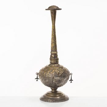 An 20th century british Raj repoussé metal rosewater sprinkler.