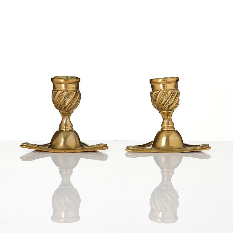 A pair of rococo brass candlesticks by Petter Hemming (master in Stockholm 1771-1807), 1772.