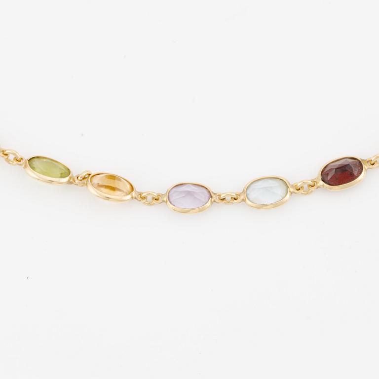 Necklace/bracelet in 18K gold with various coloured gemstones including topaz, citrine, amethyst, garnets, and peridot.