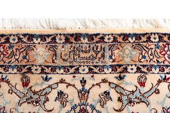 A carpet, Nain, part silk, 6 laa, c. 343 x 252 cm.