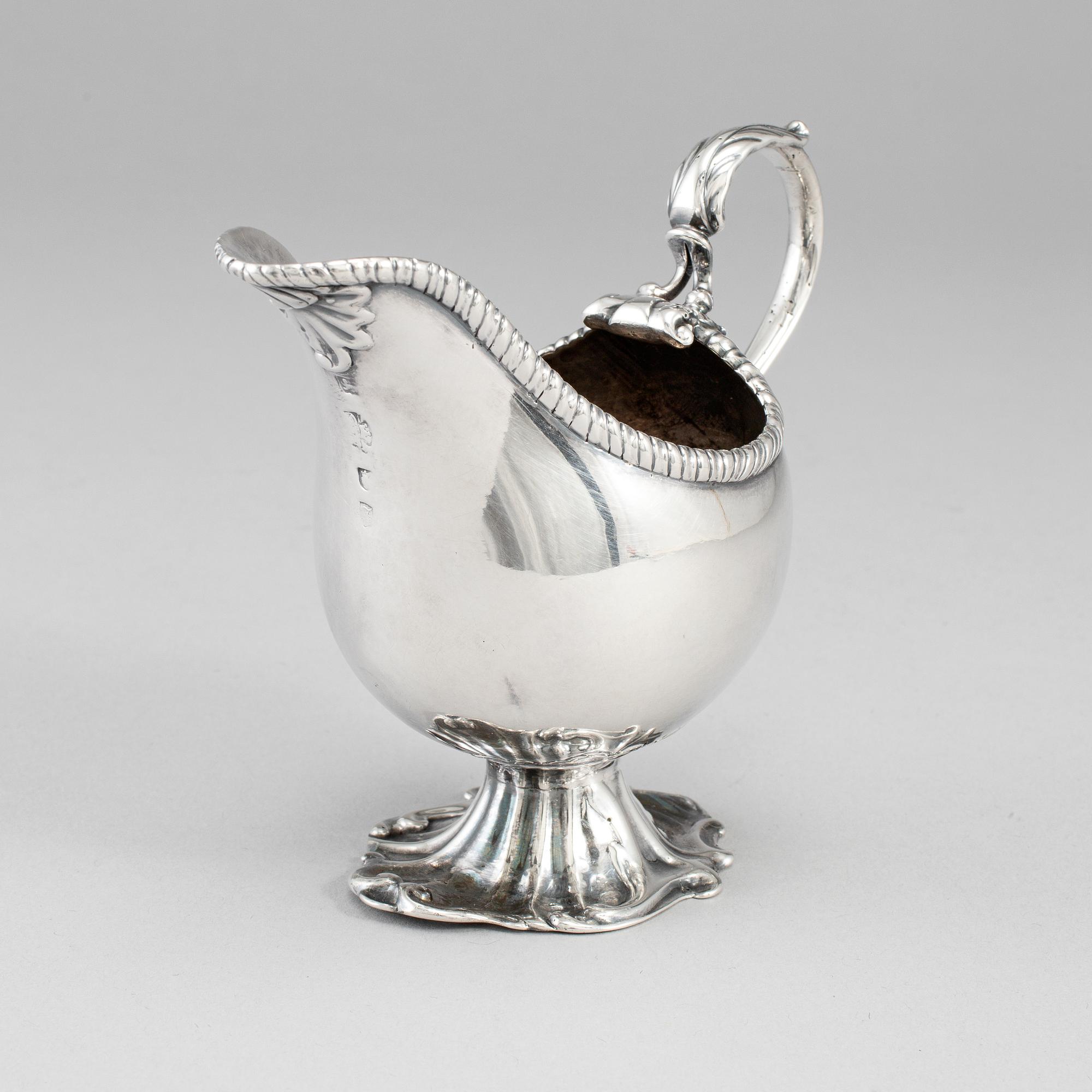 An English 18th century silver sauce-boat, unidentified makers mark, London 1764.