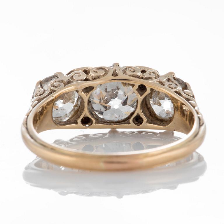 An 18K gold three stone ring with old-cut diamonds with a total weight of ca 3 cts.