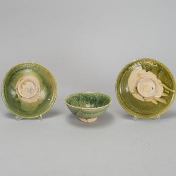 A set of two green glazed dishes, and a bowl, South East Asia 15th/16th Century.