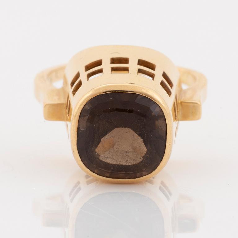 An 18K gold and smoke quartz Sigurd Persson ring.