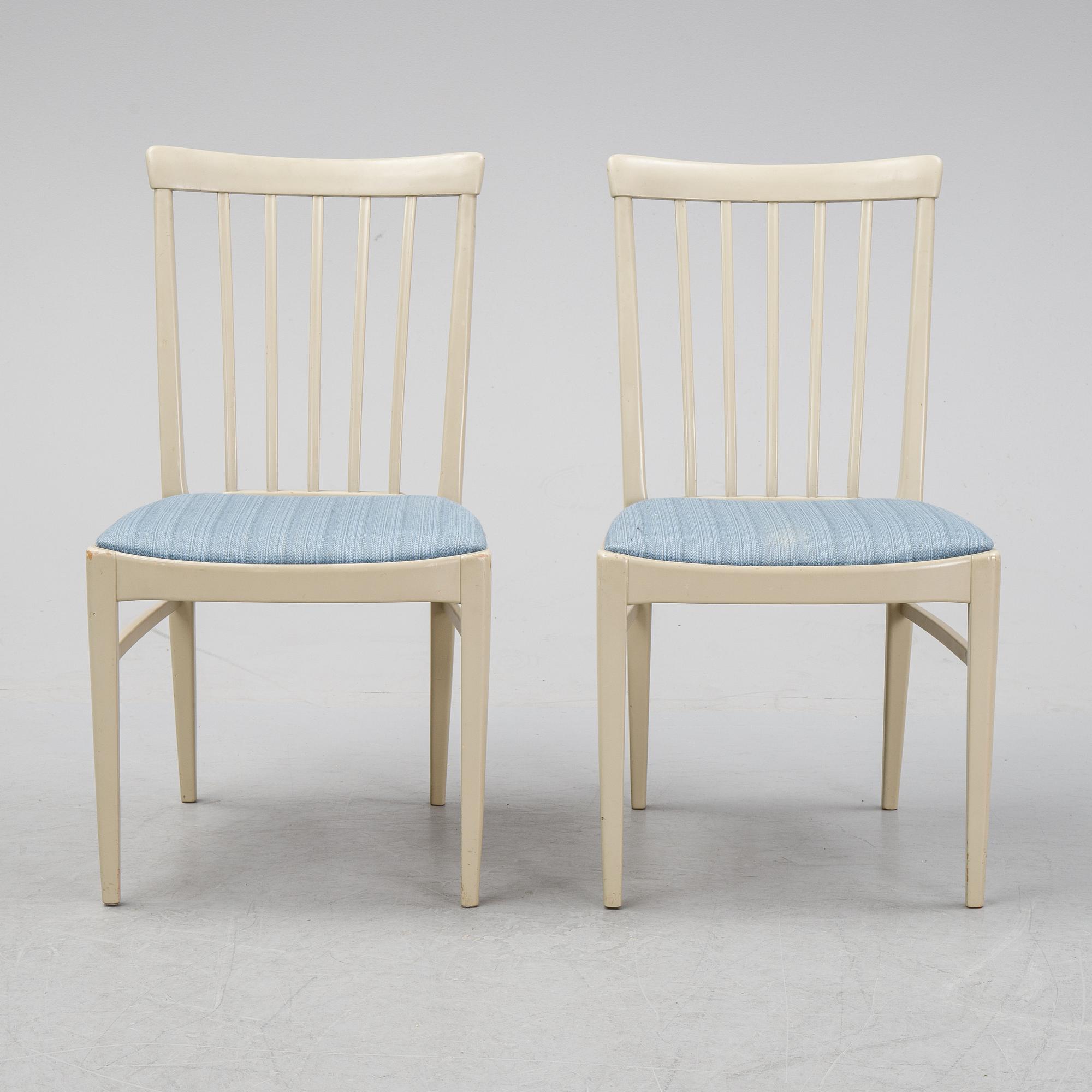 A dining table with six chairs by Carl Malmsten, second half of the 20th Century.