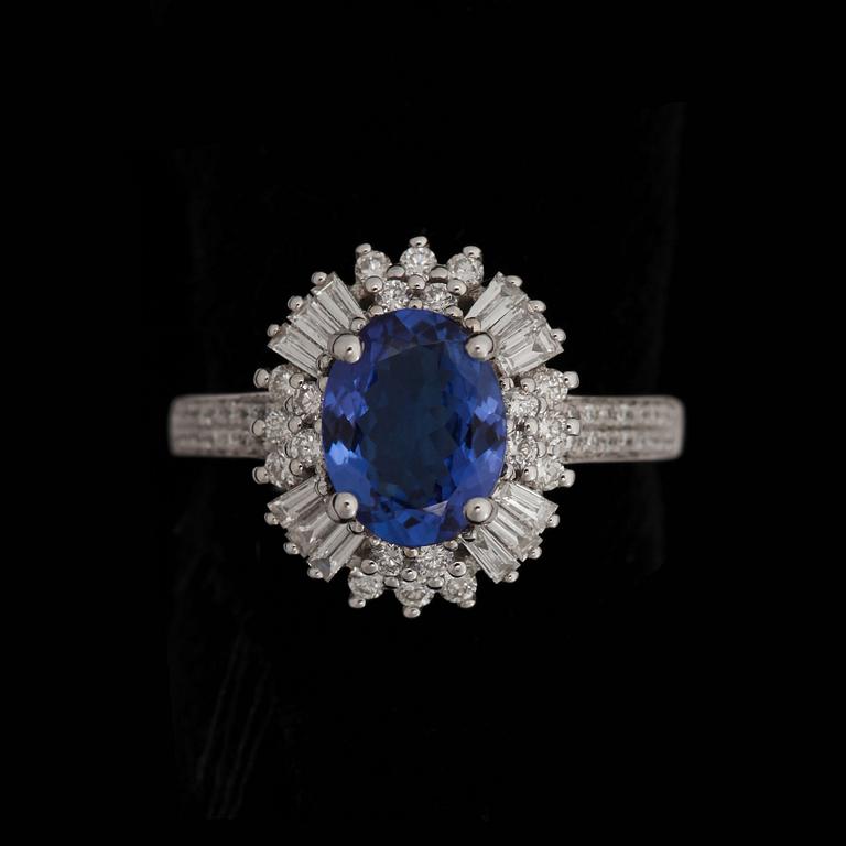 RING, fasettslipad tanzanit, 2.29 ct, med briljant- och baguetteslipade diamanter. tot. 0.95 ct.