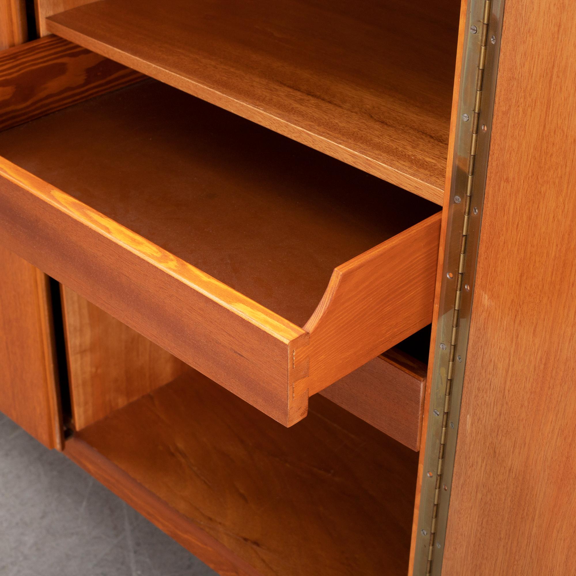 A mid 20th century teak veneered sideboard.
