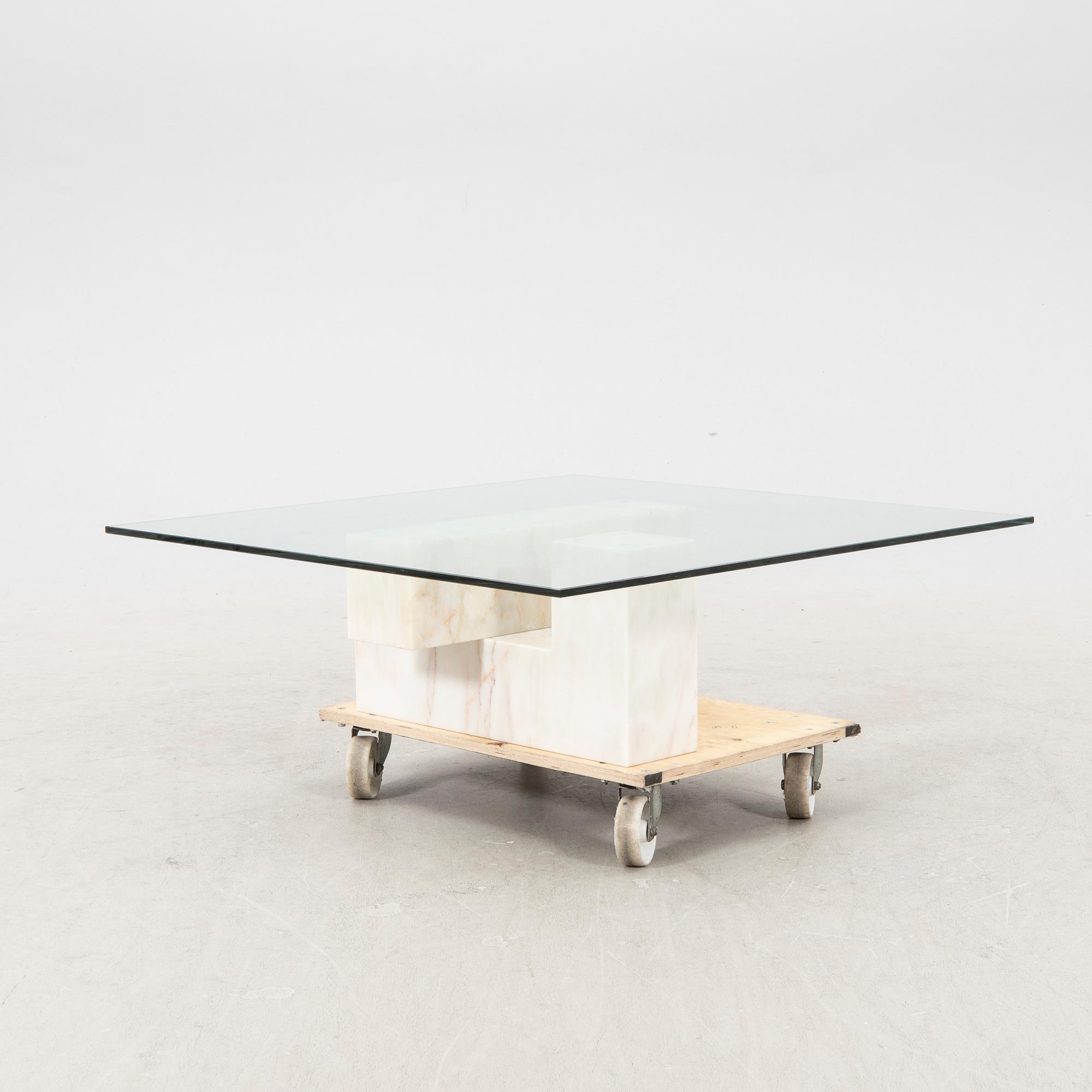 A late 20th century/21st century marble and glass coffee table.