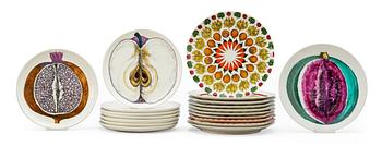 A set of nineteen Piero Fornasetti plates, Milan, Italy.