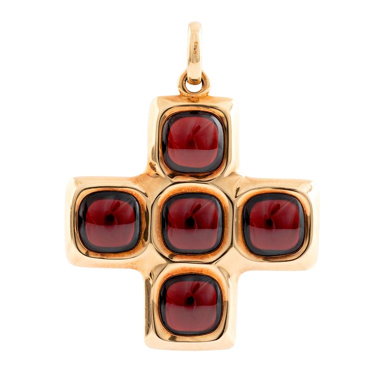 An 18K gold and garnet Pomellato cross.