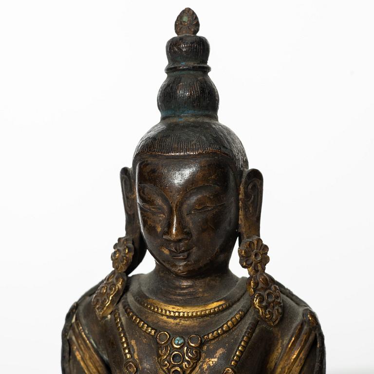 A gilt copper figure of Amitayus, Tibeto-Chinese, 18th Century.