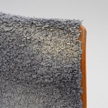 Yngve Ekström, a "Lamino" armchair with ottoman, Swedese, Sweden, late 20th century.