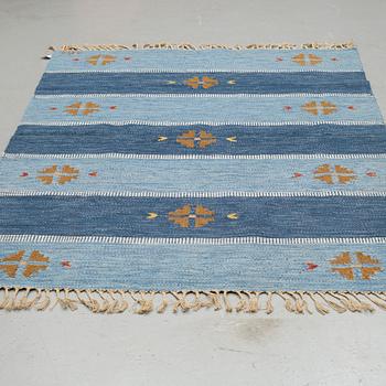 A RUG, "Falsterbo blue", flat weave,  ca 234,5 x 171 cm, it has a signature.