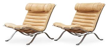 A pair of Arne Norell 'Ari' steel and leather easy chairs, Norell.