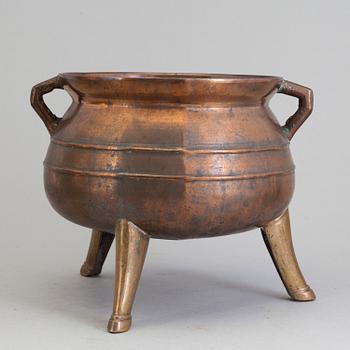 A Swedish 18th/19th century brass pot on three legs.