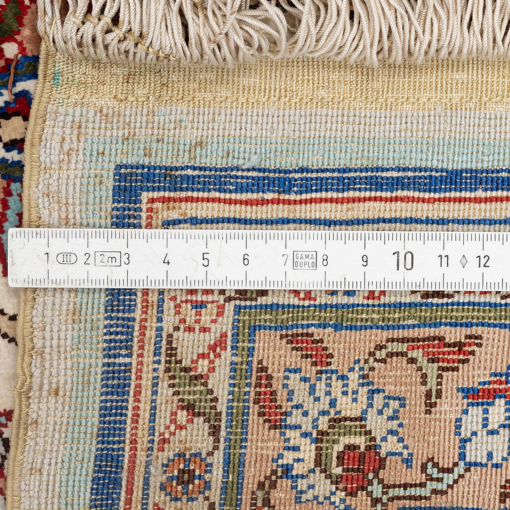 A silk Kayseri/Hereke carpet, c. 310 x 195 cm.