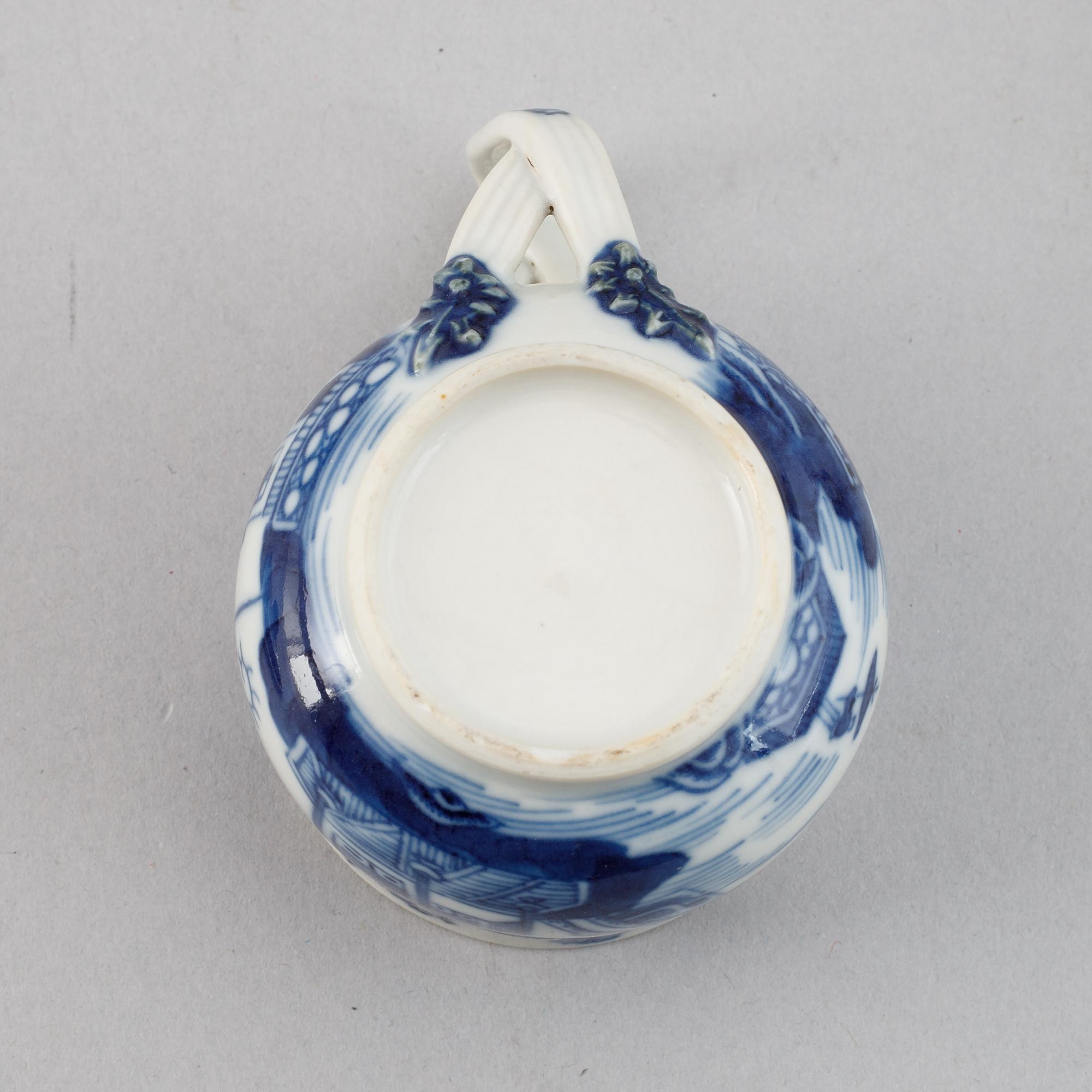 A set of six blue and white custard cups with covers,