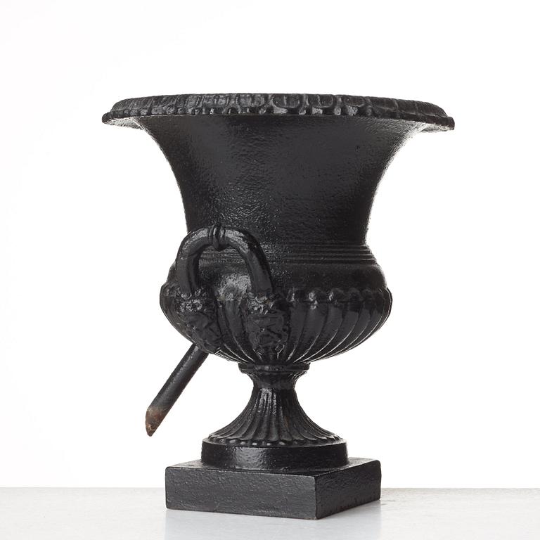 A Louis XVI-style garden urn, circa 1900.