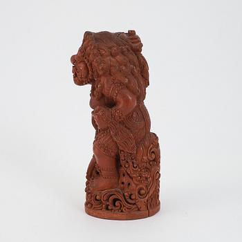 A carved wooden figure of a beast, Southeast asia, first half of the 20th Century.