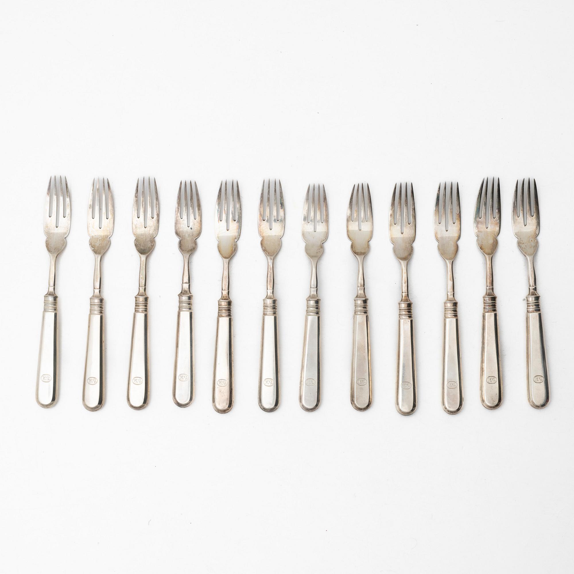 A Russian silver cutlery set, including mark of Ovchinnikov with the Imperial warrant, St Petersburg 1908-16 (24 pieces).