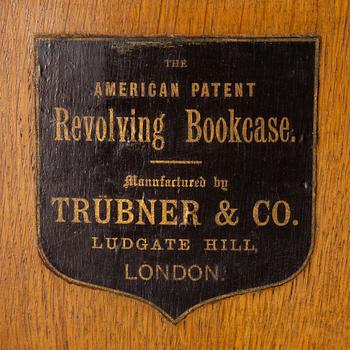 An oak Revolving bookcase by Trübner & Co, England, early 20th century.