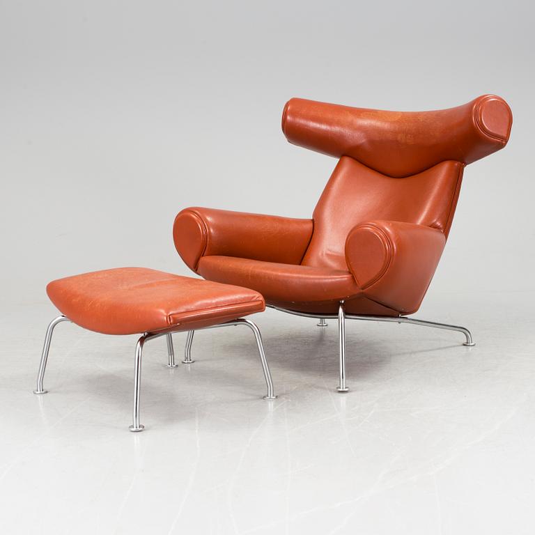 An "Ox-Chair" and foot stool by Hans J Wegner for Erik Jorgensen, Denmark.