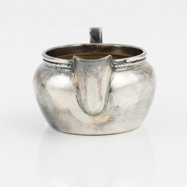 Three silver bowls and creamer, Sweden and Germany, 20th century.