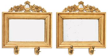 A pair of Swedish Empire two-light girandole mirrors.