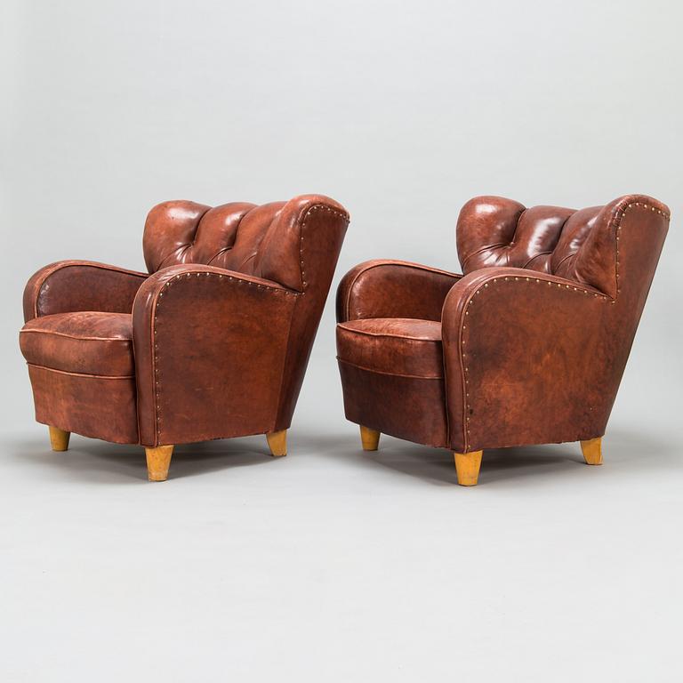 A pair of mid-20th century armchairs.