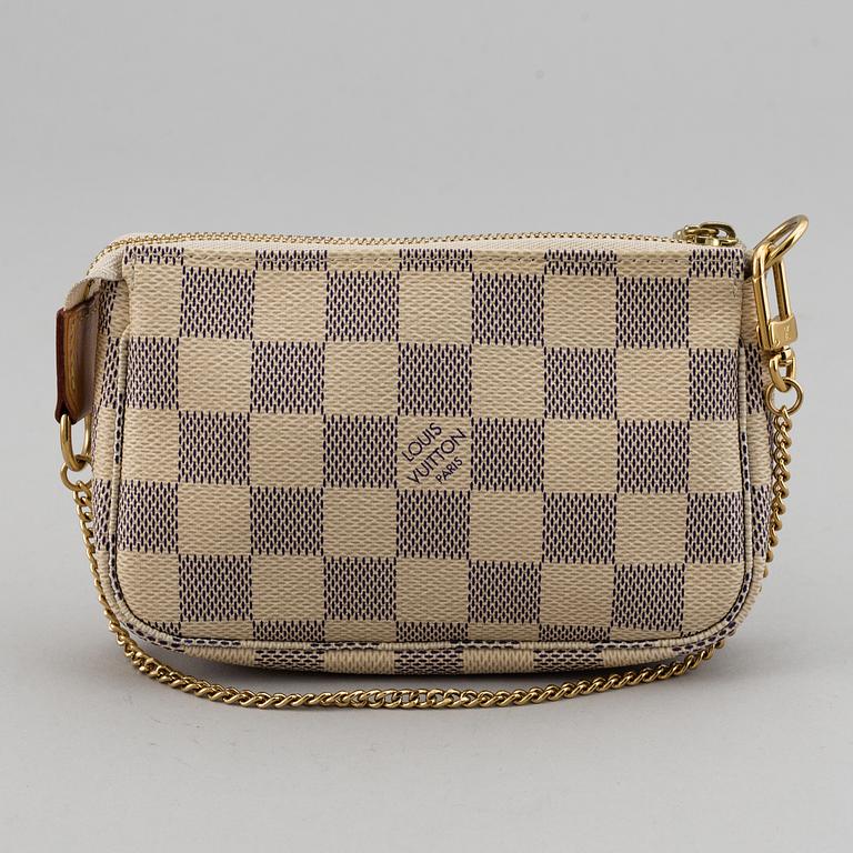 LOUIS VUITTON, A 'Mini Pochette Accessoires' and a shoulder strap.