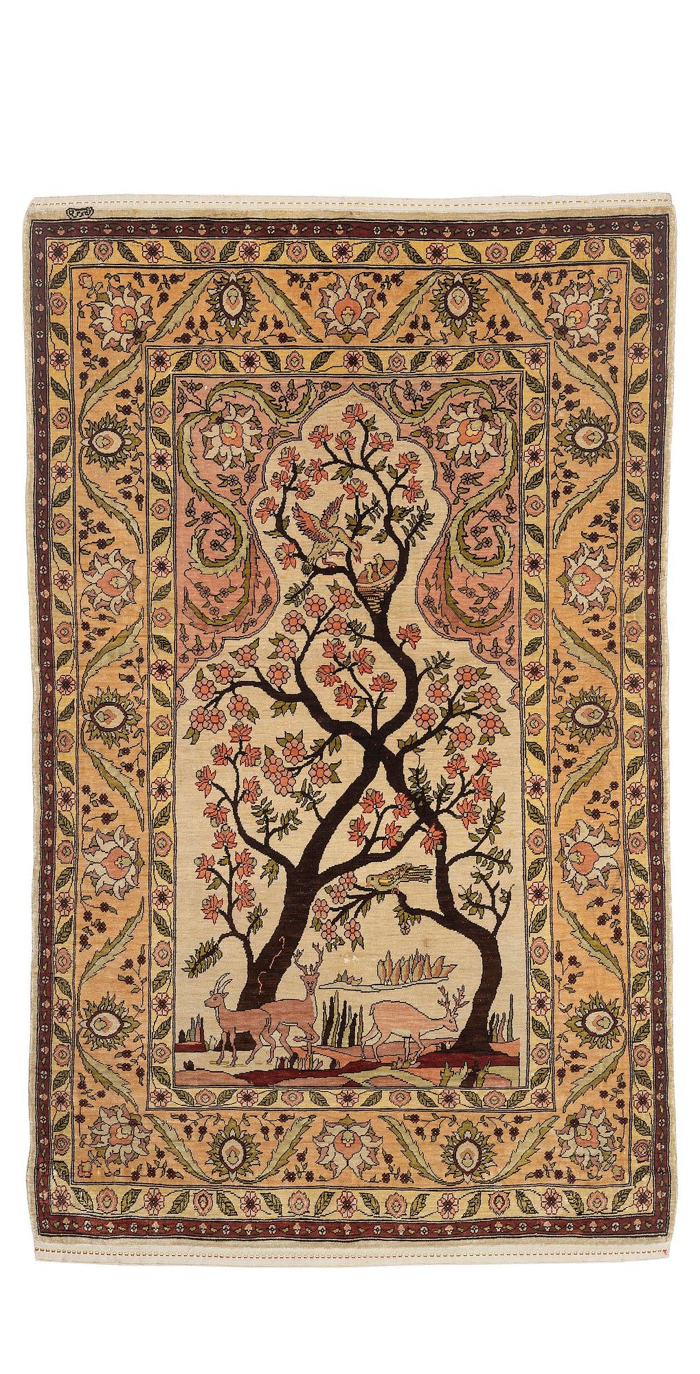A semi-antique / old silk Hereke rug, West Anatolia, c. 100 x 60 cm.