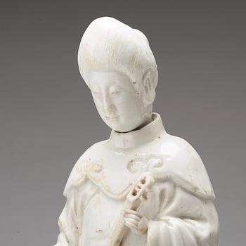 A blanc de chine figure of a lady-in-waiting, Qing dynasty, Kangxi (1662-1722).