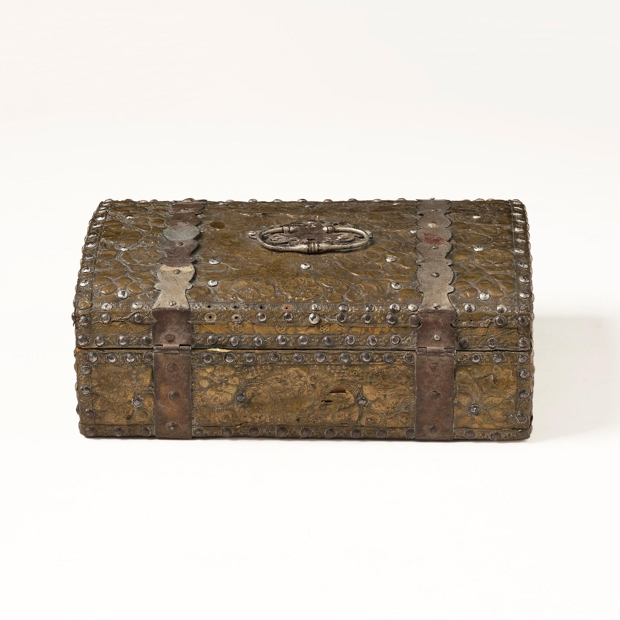 A presumably German baroque repoussé brass writing box, late 17th century.