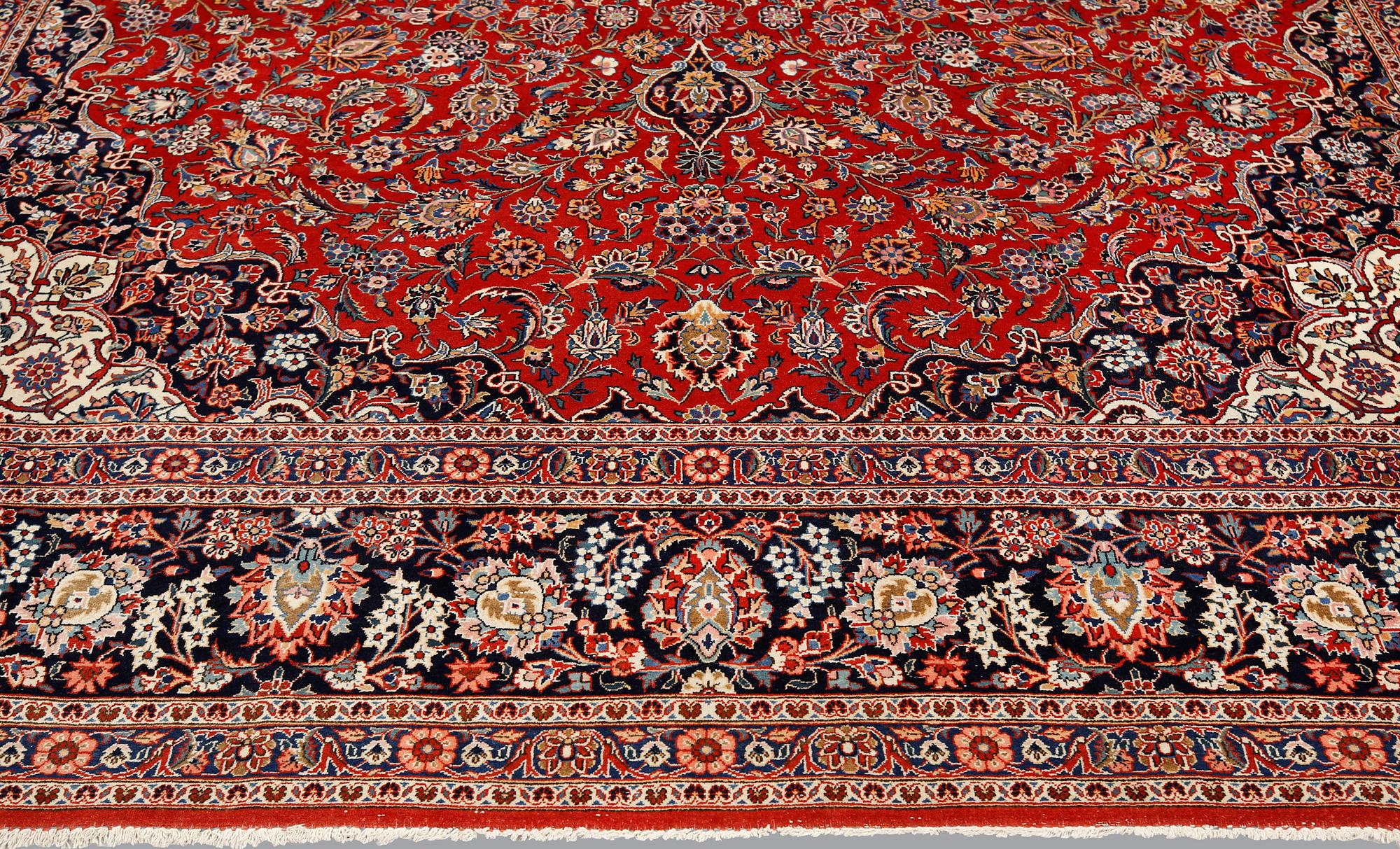 Carpet, Keshan, semi-antique, signed, 439 x 316 cm.